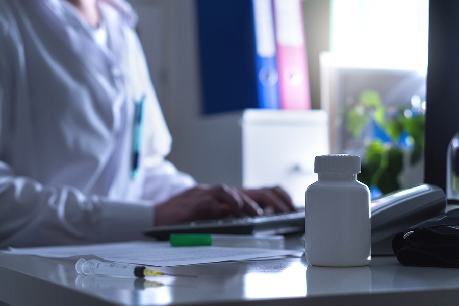 Fake doctor or quack promoting false medical treatment to patient indoors