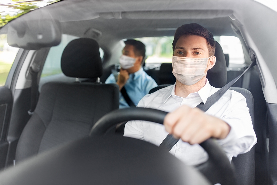 An uninsured driver wearing a mask