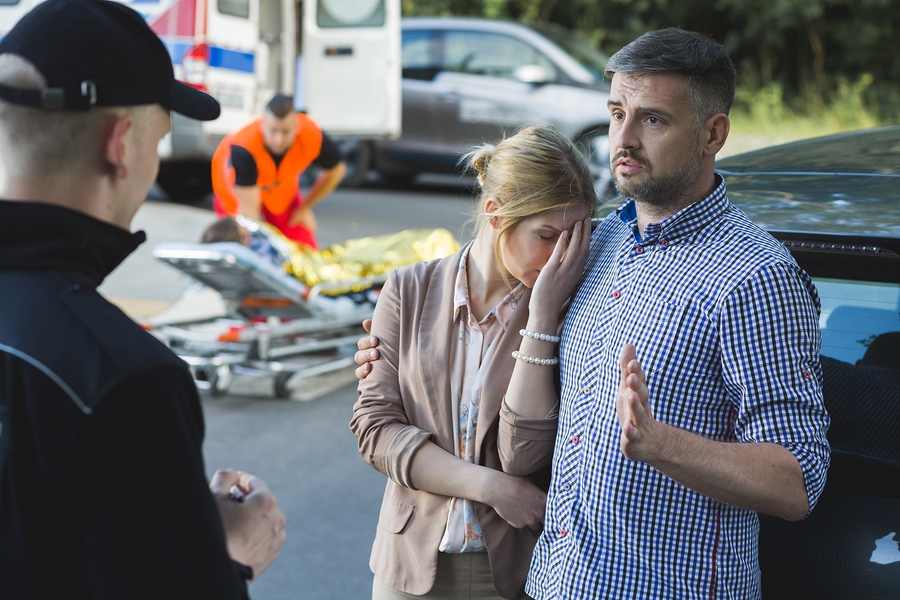 Distressed man crying in grief after a tragic accident, overwhelmed with shock and emotional pain