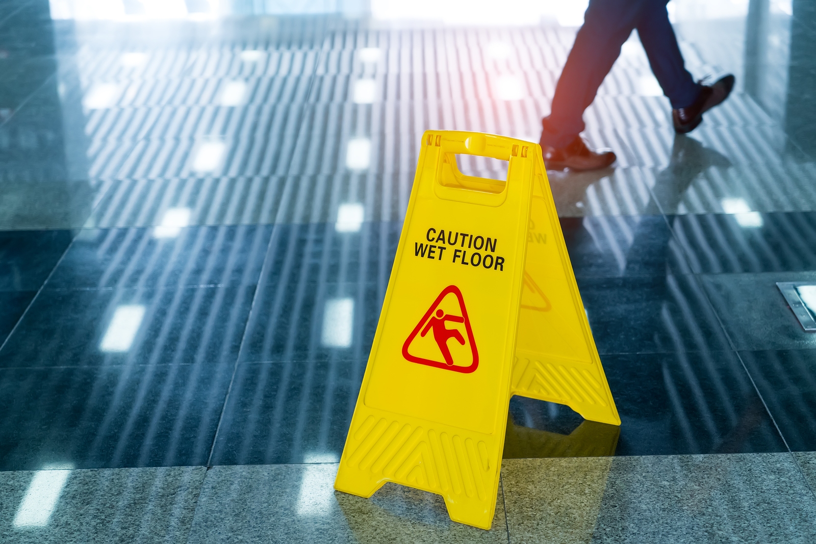 Caution wet floor sign warning of a slippery surface hazard