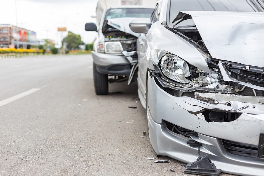 Rear-end collision accident with one car hitting the back of another vehicle on the road