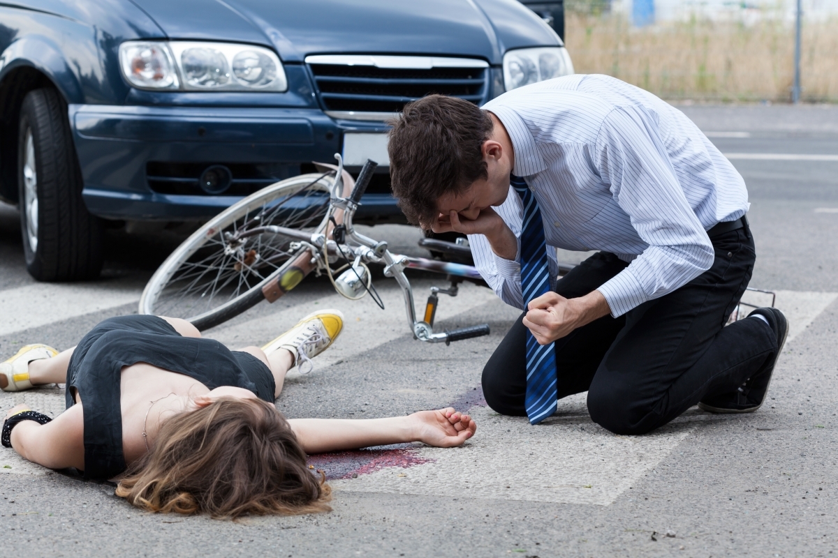 Severely damaged vehicles at the scene of a fatal road traffic accident with emergency response presence