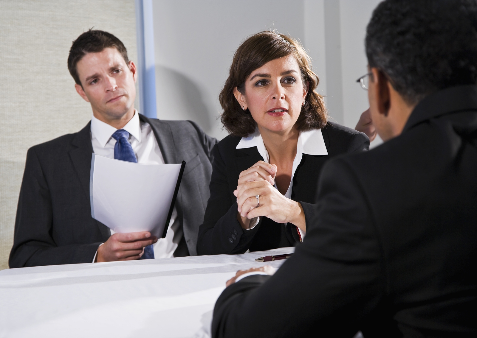 Businesswoman negotiating contract with client during professional office meeting discussion