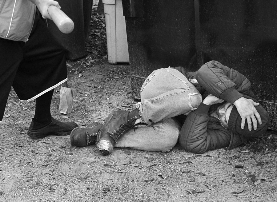 Hate crime concept depicting violence and discrimination