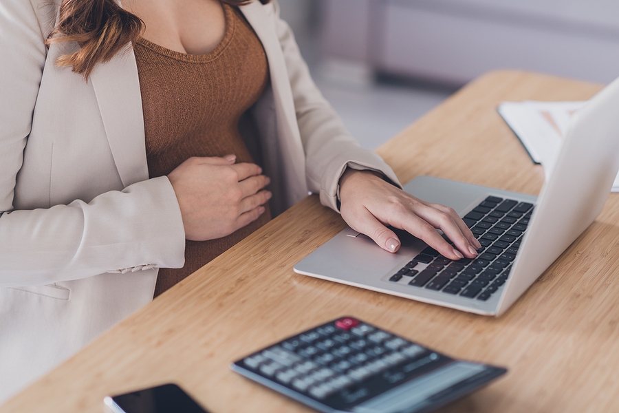 pregnant women working on a laptop