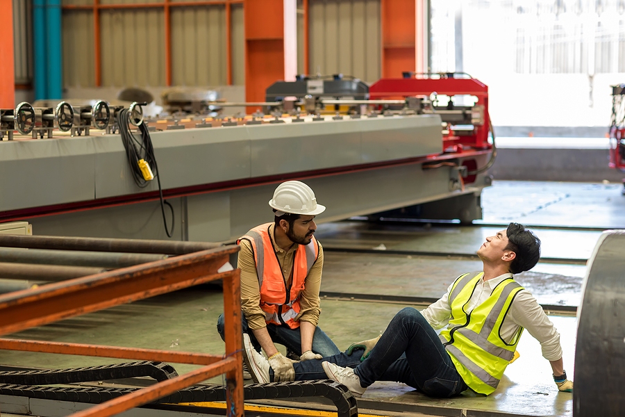 Personal injury lawyer consulting client after accident claim in Kansas law office setting