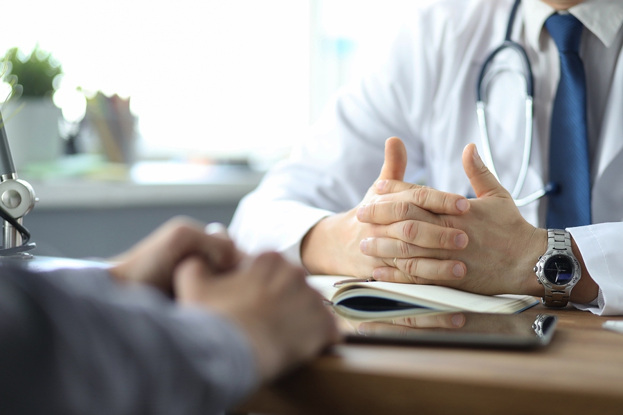 Close-Up of Doctor Consulting Patient in Medical Office